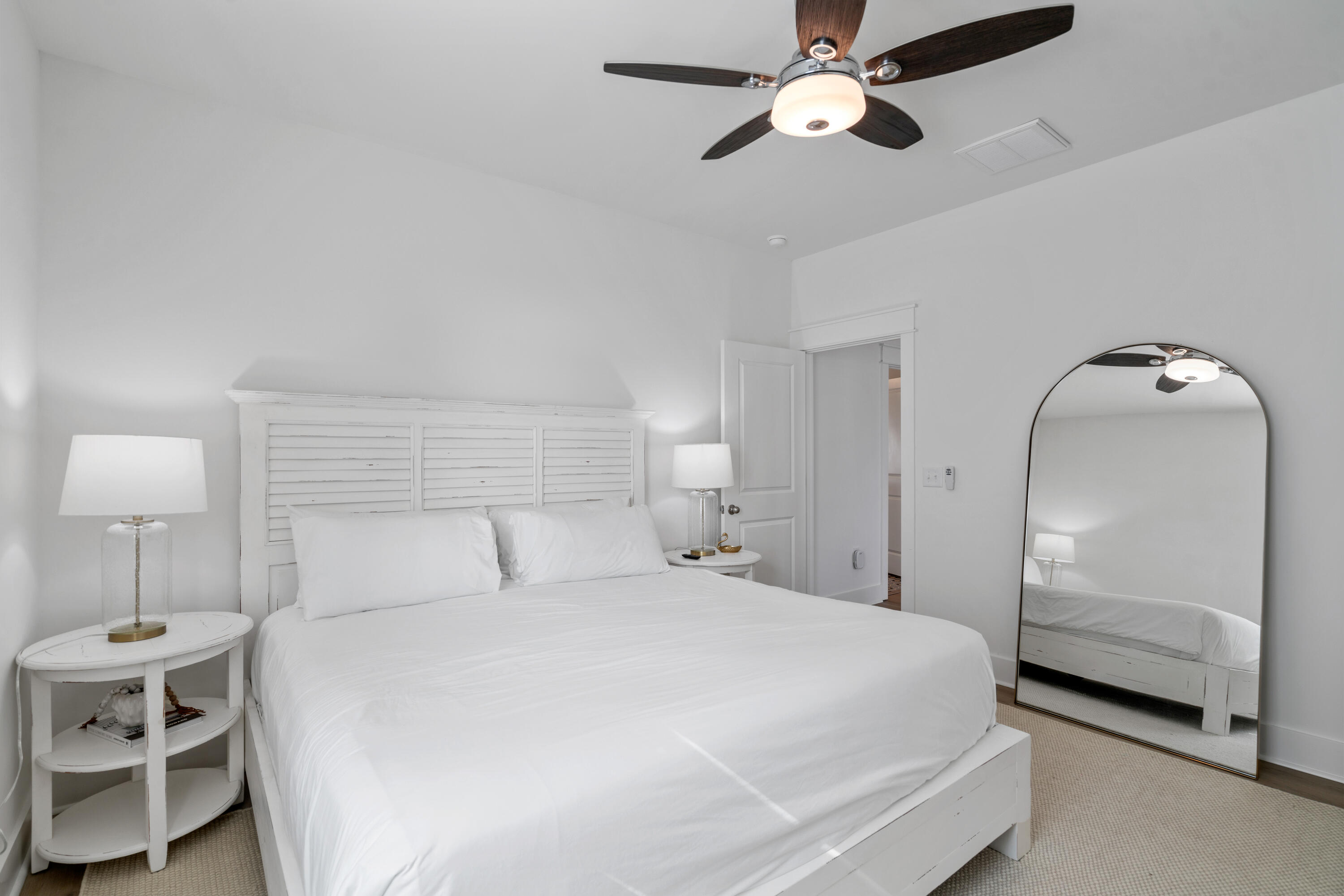 49 Conscience Way Santa Rosa Beach, FL 32459 - Photo 40 of 50 a bedroom with a bed and a lamp