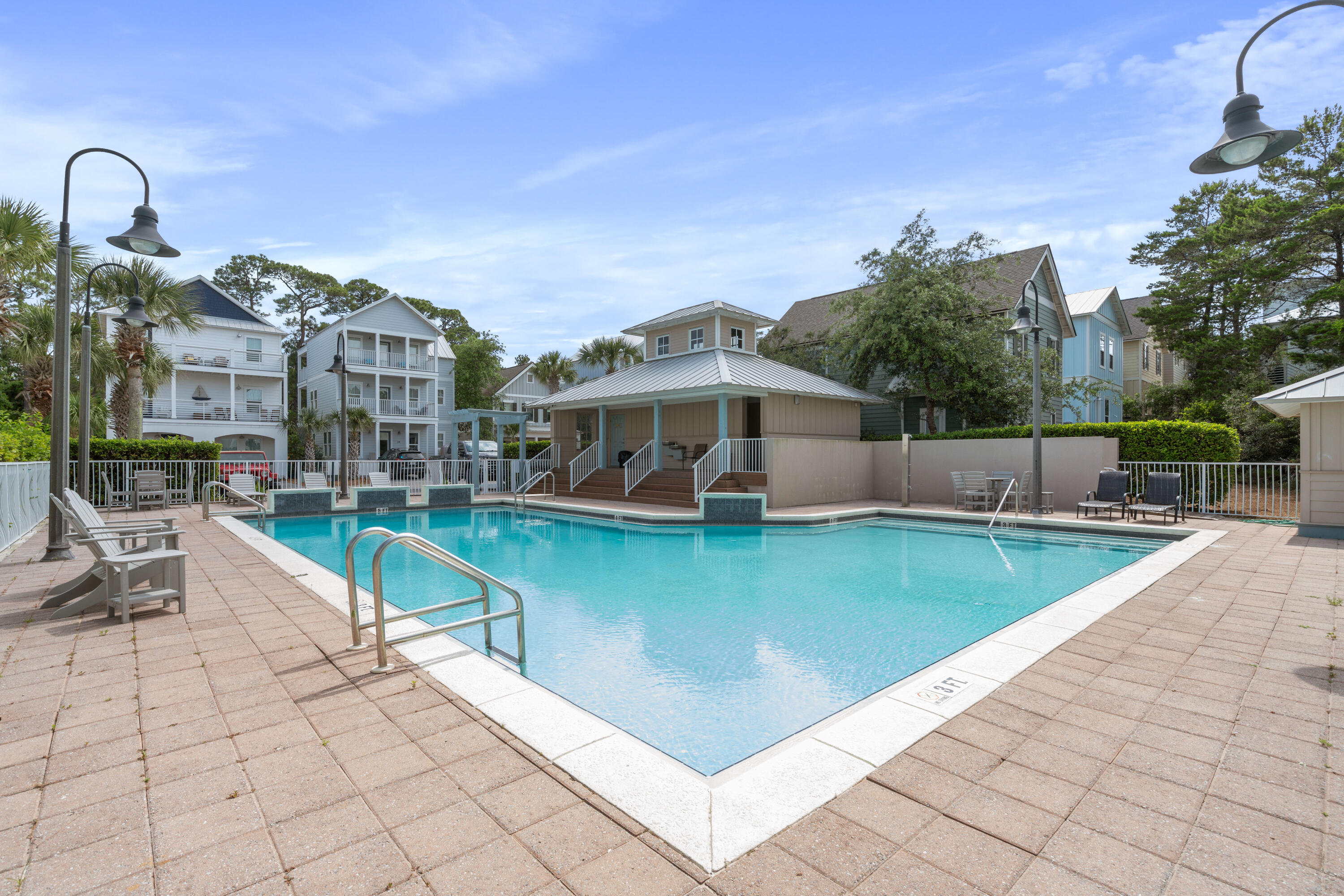 49 Conscience Way Santa Rosa Beach, FL 32459 - Photo 48 of 50 a view of a swimming pool with a lounge chairs