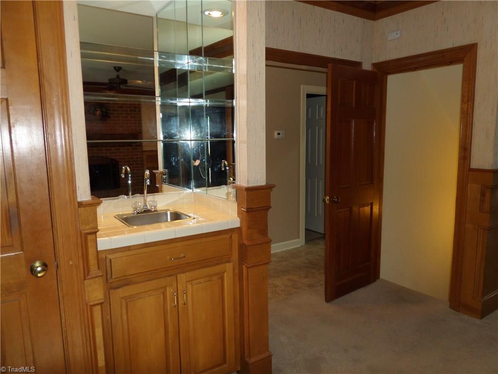 1170 Chester Road Winston-Salem, NC 27104 - Photo 14 of 30 Wet bar for entertaining and a coat closet to the left.