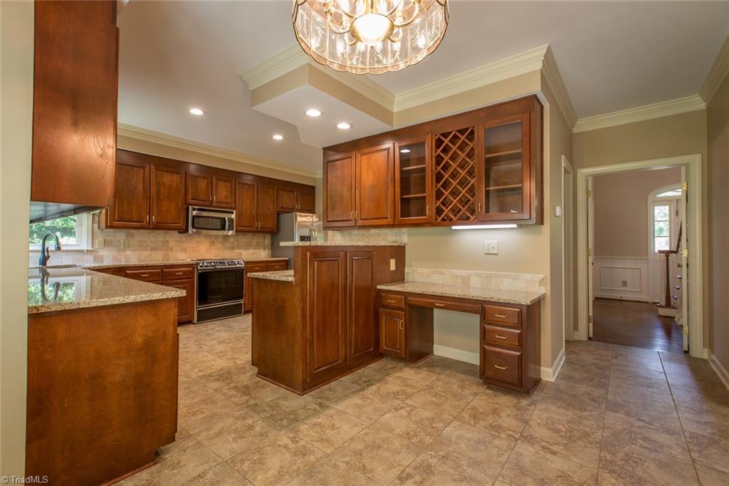 1170 Chester Road Winston-Salem, NC 27104 - Photo 15 of 30 Updated kitchen with granite counters, tumble marble back splash and tile flooring.