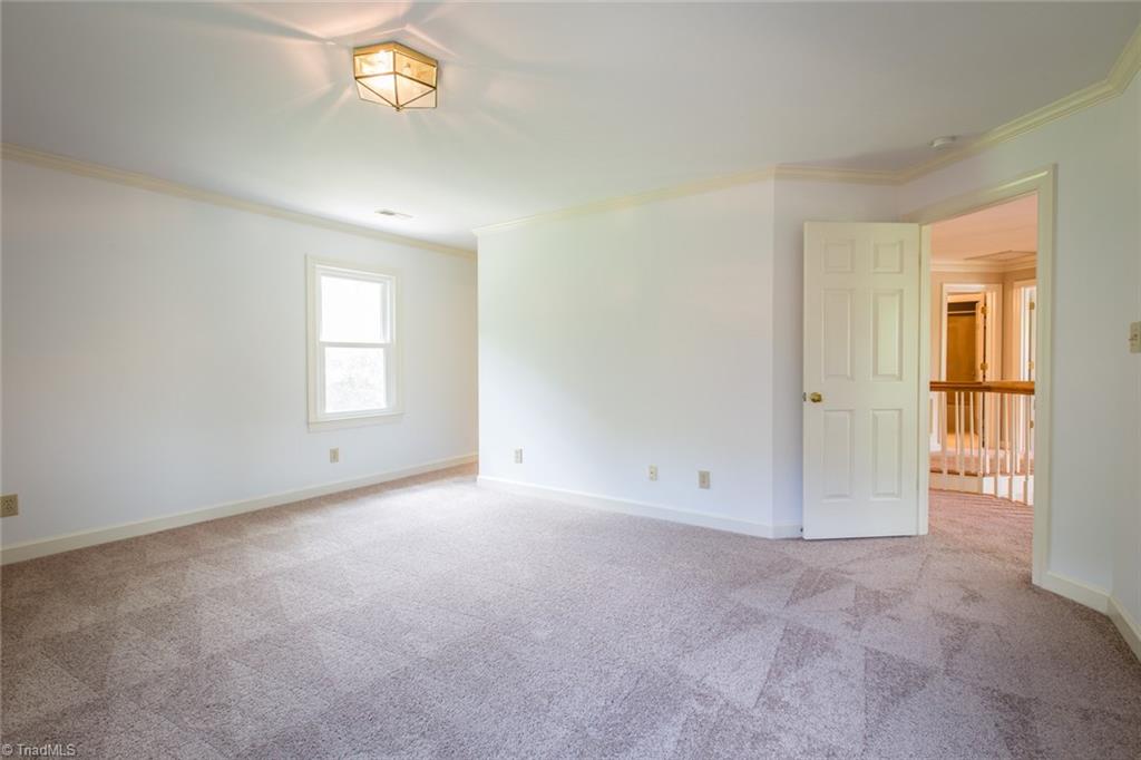 1170 Chester Road Winston-Salem, NC 27104 - Photo 19 of 30 Another view of the master bedroom which has a walk in closet and a closet organizer.