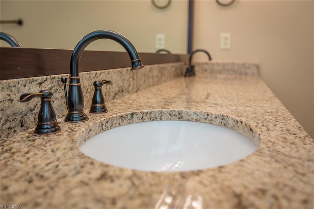 1170 Chester Road Winston-Salem, NC 27104 - Photo 21 of 30 Beautifully updated master bath vanity and attractive faucets.