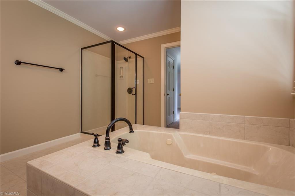 1170 Chester Road Winston-Salem, NC 27104 - Photo 22 of 30 Another view of the master bath with the separate shower and tile around the tub and floor. Neutral dcor!