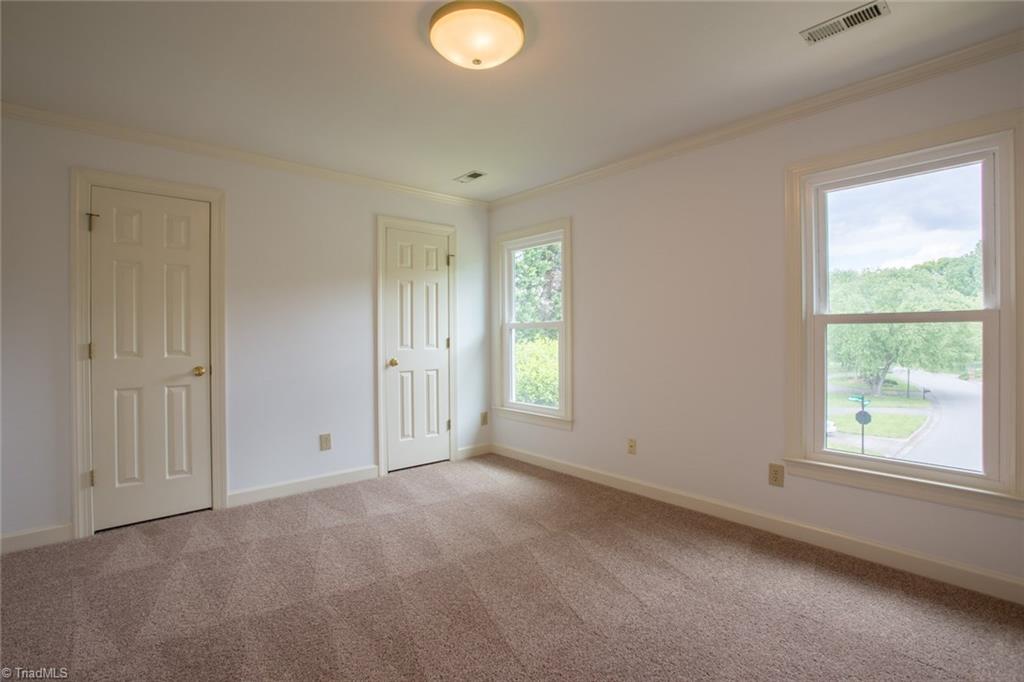 1170 Chester Road Winston-Salem, NC 27104 - Photo 24 of 30 Third bedroom also has doublet closets, crown molding and an overhead light fixture.