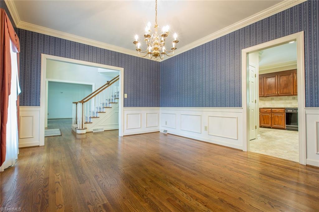 1170 Chester Road Winston-Salem, NC 27104 - Photo 8 of 30 Another view of the dining room which has crown molding, box molding and a wide opening to the kitchen on the right.