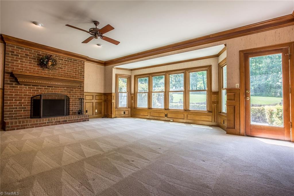 1170 Chester Road Winston-Salem, NC 27104 - Photo 10 of 30 Handsome Great Room to fit all your large furniture. Detail abounds with crown molding, wainscoting, masonry fireplace and a large bay area.
