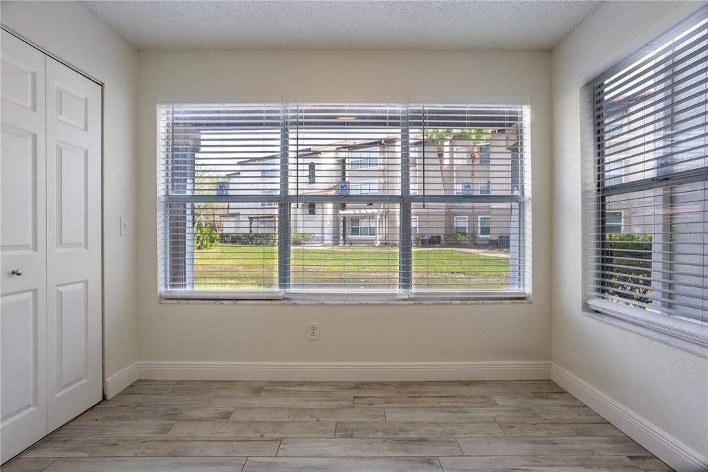 5156 Conroy Road, Unit 16 Orlando, FL 32811 - Photo 11 of 16 a view of an empty room with a window