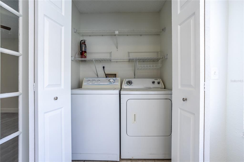 5156 Conroy Road, Unit 16 Orlando, FL 32811 - Photo 13 of 16 a utility room with dryer and washer