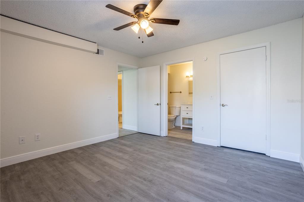 5156 Conroy Road, Unit 16 Orlando, FL 32811 - Photo 15 of 16 a view of an empty room and wooden floor