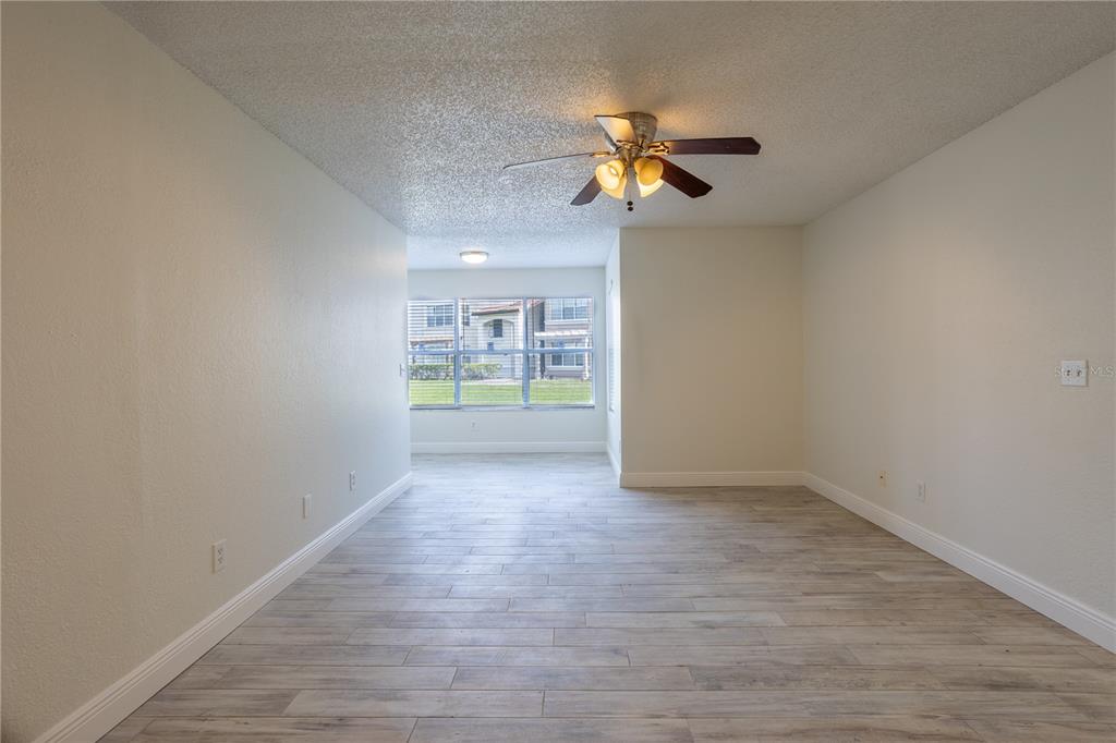 5156 Conroy Road, Unit 16 Orlando, FL 32811 - Photo 4 of 16 a view of an empty room with a window