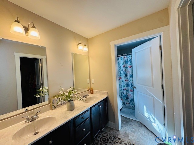 378 Halls Store Road Mineral, VA 23117 - Photo 20 of 35 a bathroom with a double vanity sink a large mirror and a shower