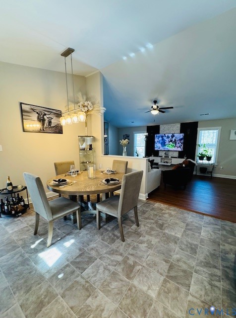 378 Halls Store Road Mineral, VA 23117 - Photo 34 of 35 a dining room with a wooden table and chairs