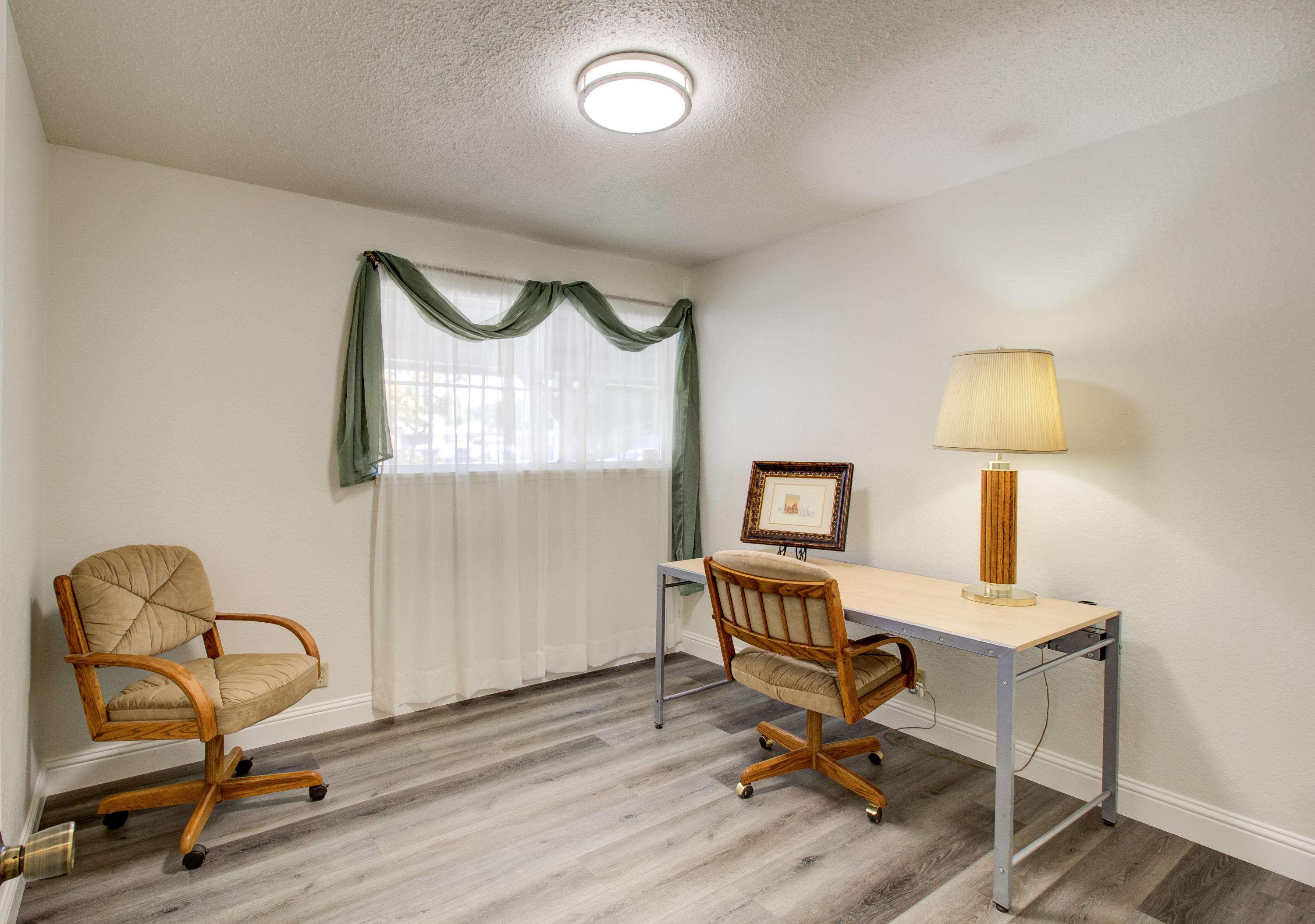 2602 Irwin Road Redding, CA 96002 - Photo 13 of 27 a view of a workspace with furniture and a window