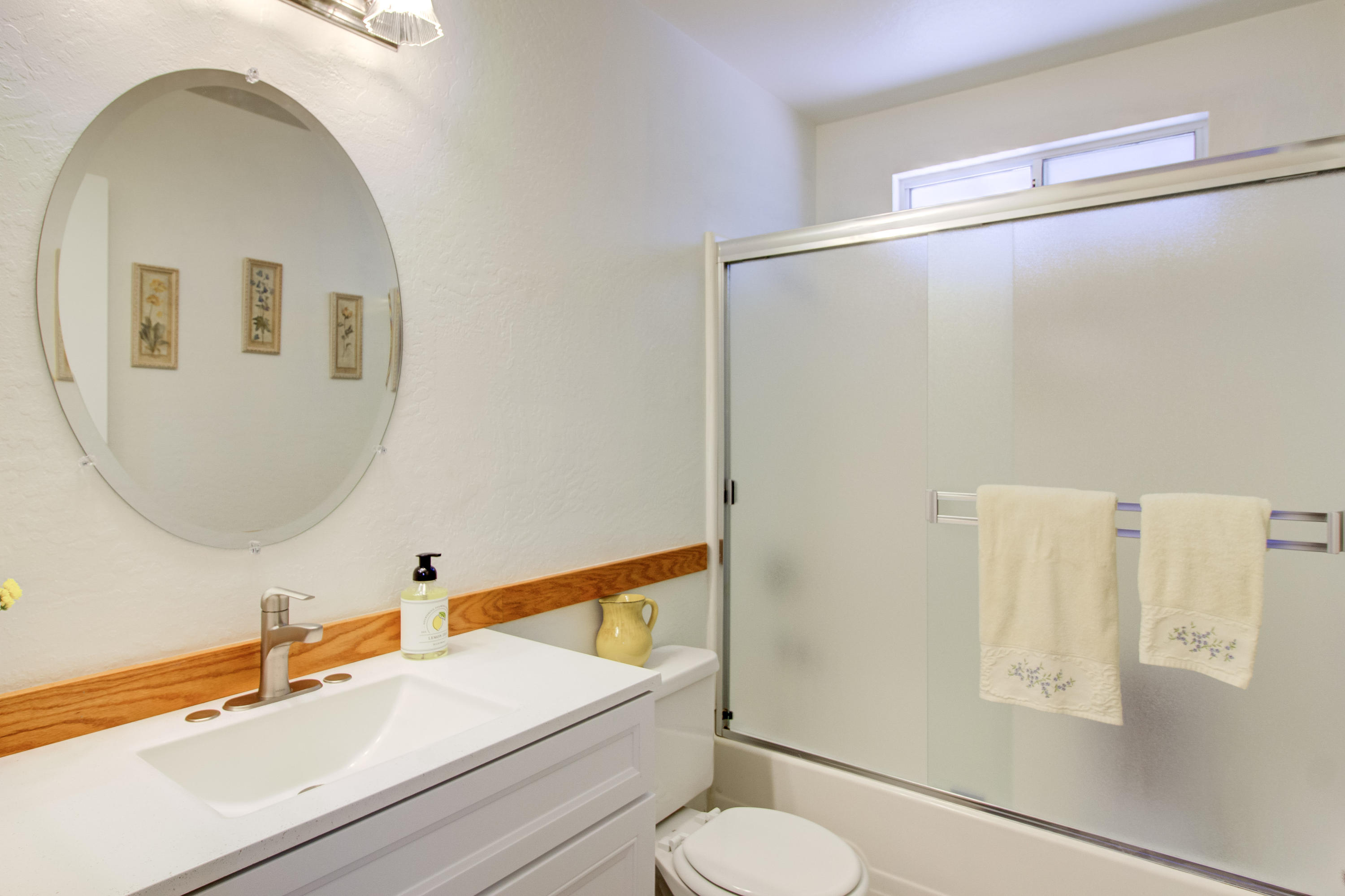 2602 Irwin Road Redding, CA 96002 - Photo 15 of 27 a bathroom with a sink mirror vanity and toilet