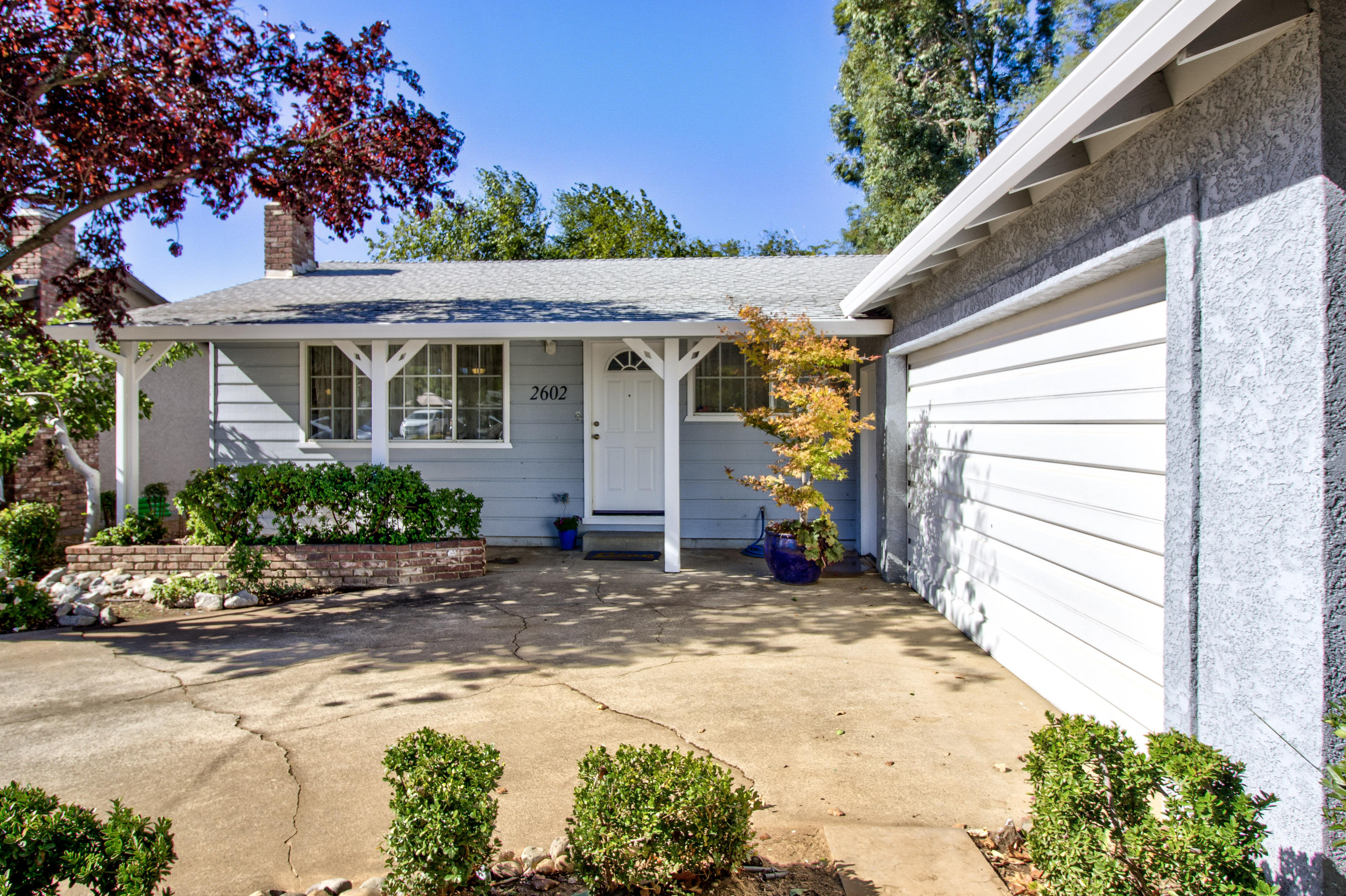 2602 Irwin Road Redding, CA 96002 - Photo 2 of 27 a view of a house with a small yard and plants