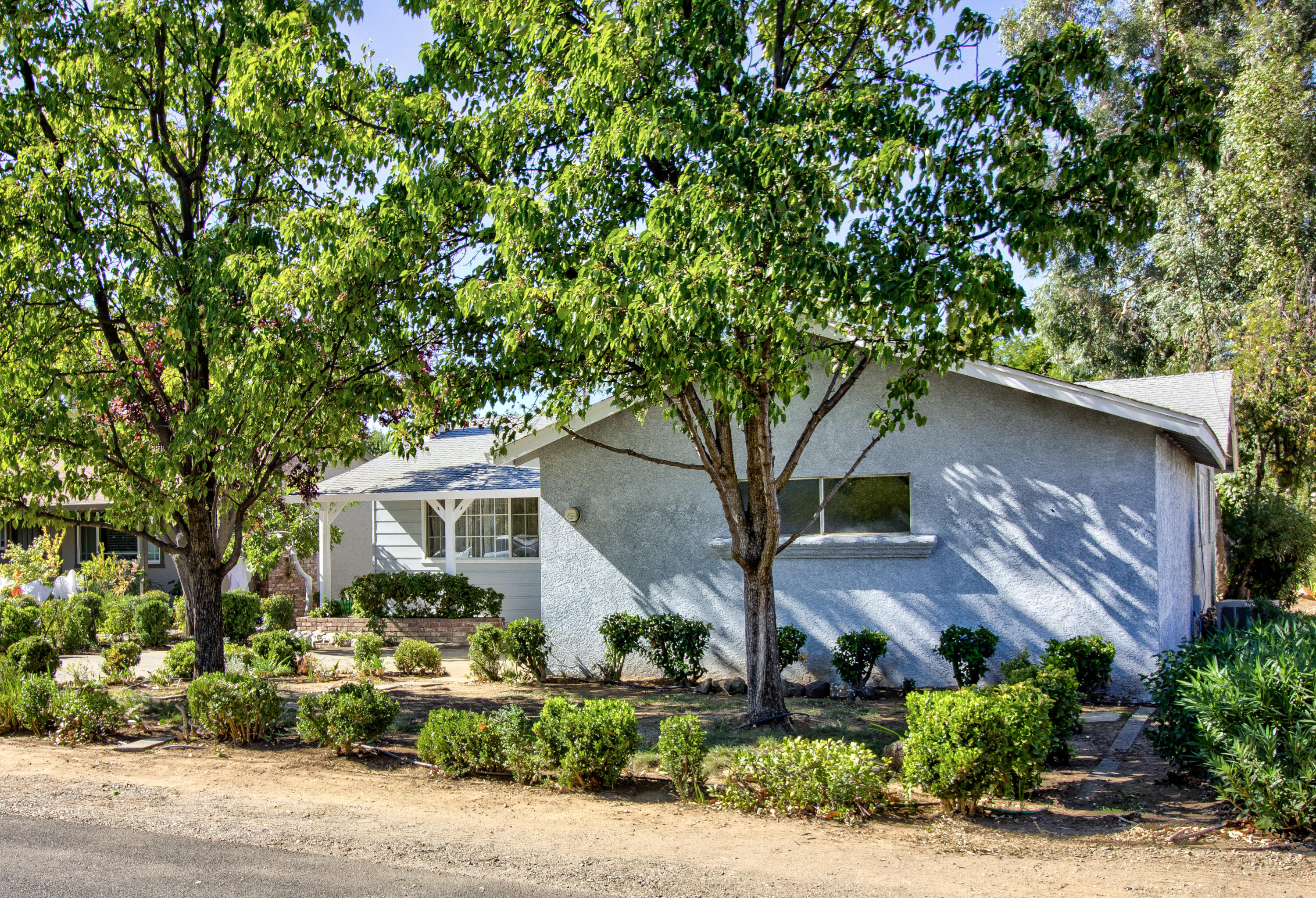 2602 Irwin Road Redding, CA 96002 - Photo 3 of 27 a front view of a house with a yard and garage