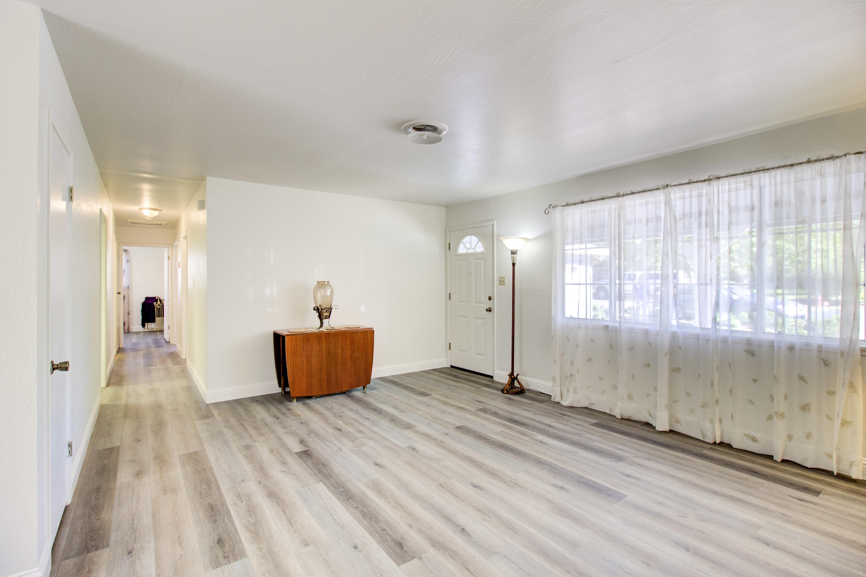 2602 Irwin Road Redding, CA 96002 - Photo 6 of 27 wooden floor in an empty room with a window