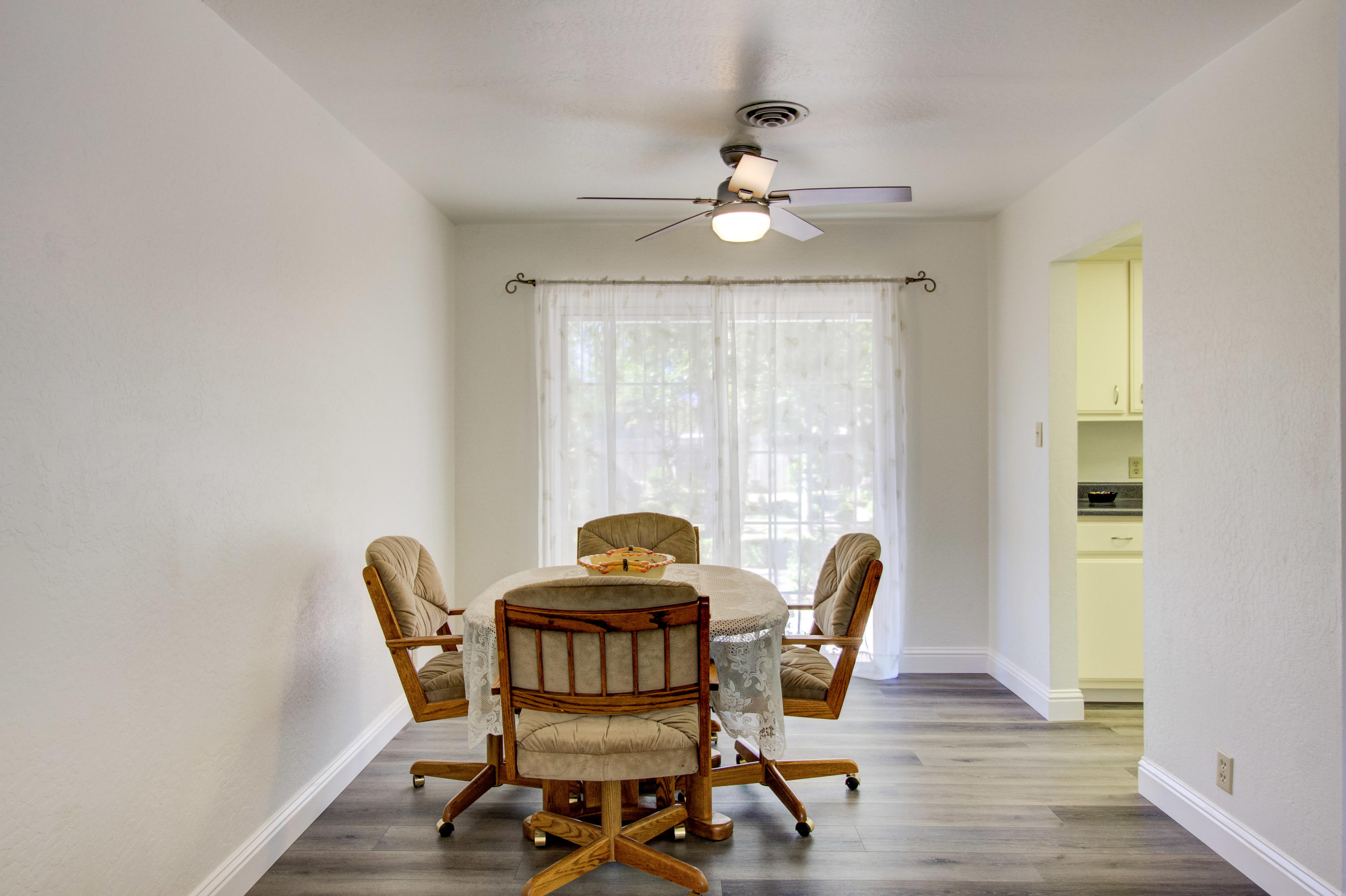 2602 Irwin Road Redding, CA 96002 - Photo 8 of 27 a view of a dining room with furniture window and wooden floor
