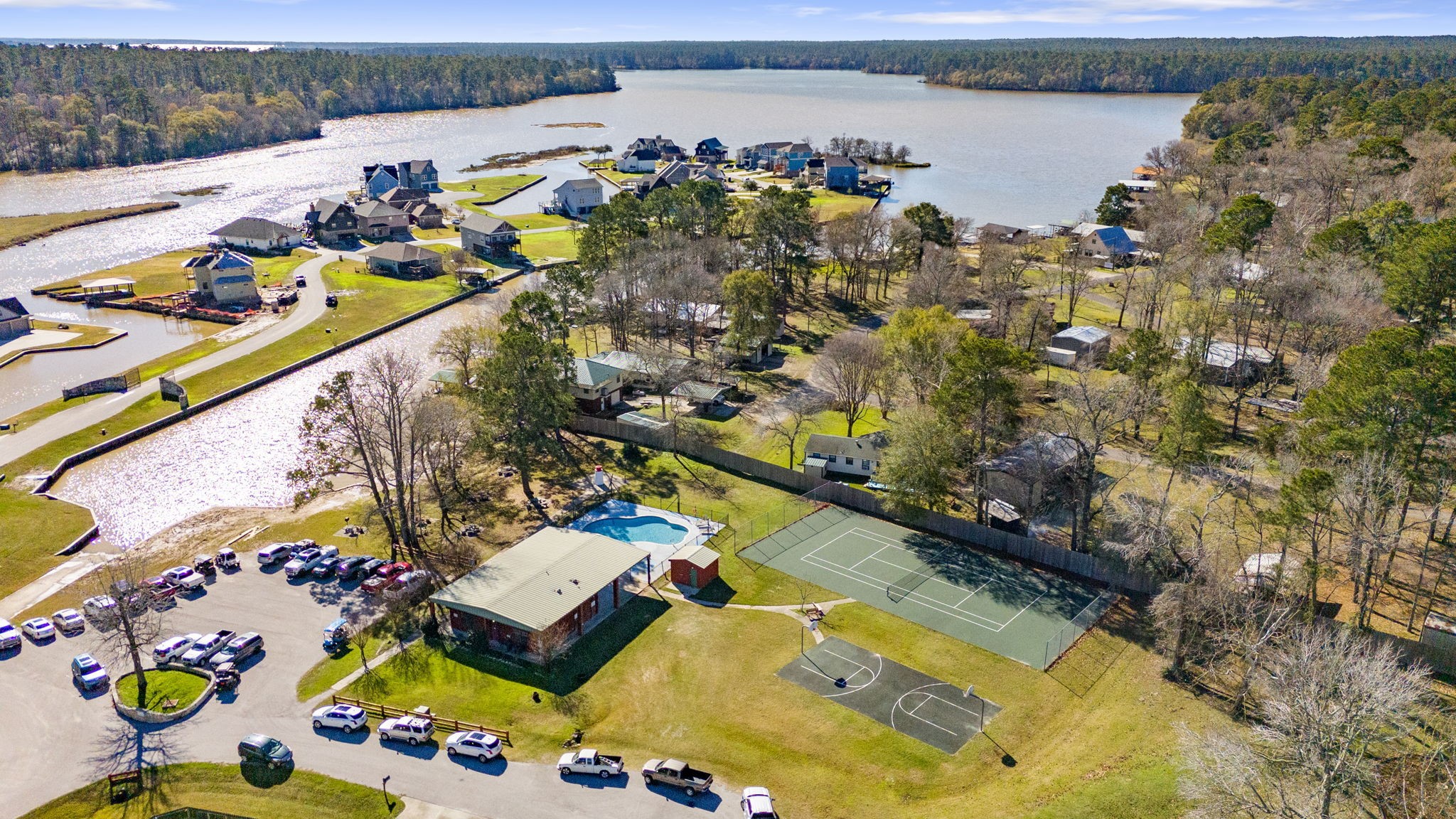 5 Island Point Huntsville, TX 77340 - Photo 11 of 15 Tennis, basketball, pool, clubhouse, boat launch, and park are all in view here....this is a separate pool from the marina pool in an earlier picture...