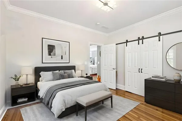 a bedroom with a bed and a couch