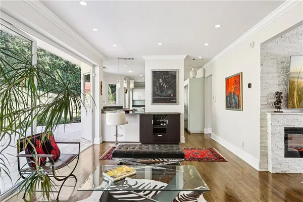 a kitchen with a sink a window stainless steel appliances and cabinets