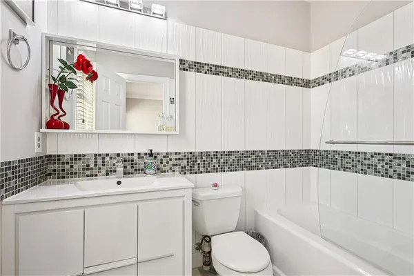 an aerial view of a house with large trees