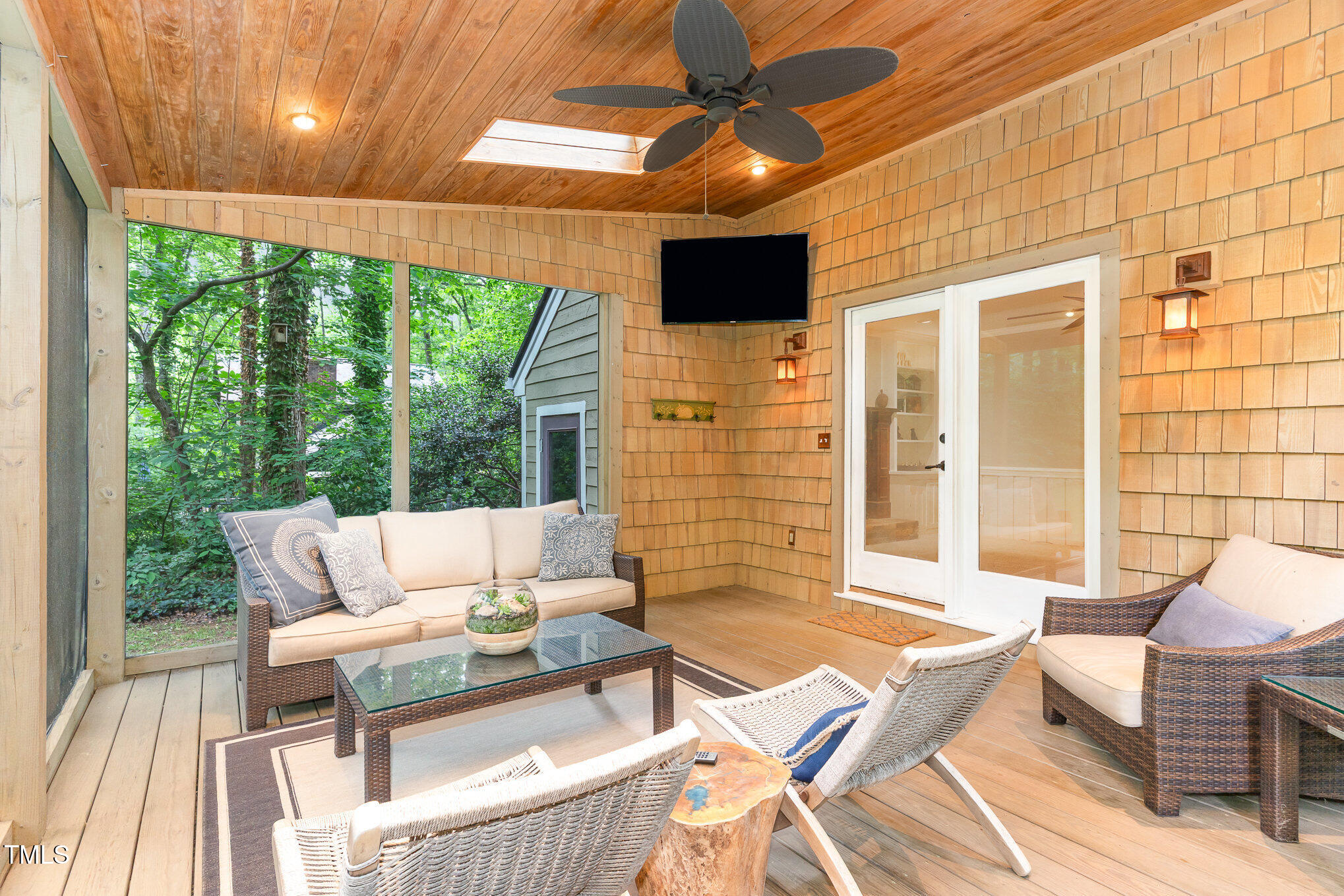 12709 Timberlane Court Raleigh, NC 27613 - Photo 28 of 44 Screened Patio for another peaceful experience at this Forested, Colonial Retreat. TV conveys for all your sports games. (Non-permitted)