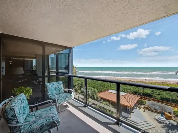 a view of a balcony with an ocean view
