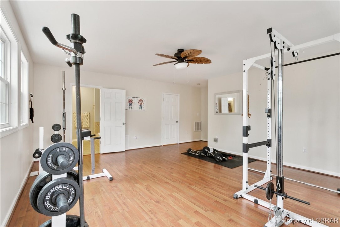 345 Fox Hill Road Hampton, VA 23669 - Photo 24 of 46 Workout room featuring visible vents, baseboards, light wood-type flooring, and a ceiling fan