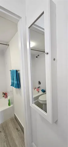 a bathroom with a tub and shower