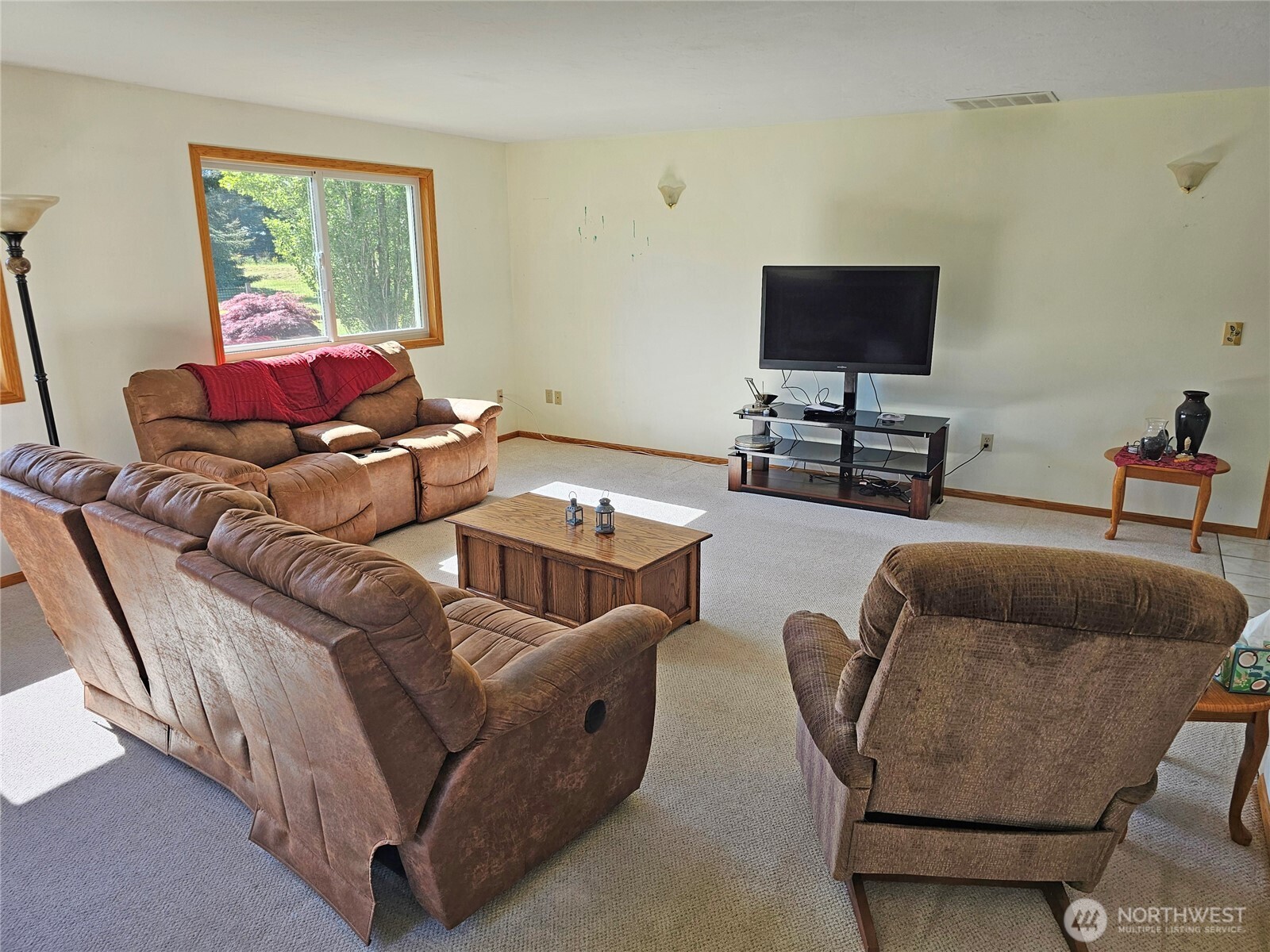 17103 Camas Run Lane Southwest Rochester, WA 98579 - Photo 18 of 40 a living room with furniture and a flat screen tv