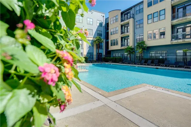 a view of a house with a yard and garden