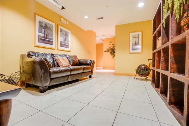 a spacious bedroom with a bed and a couch