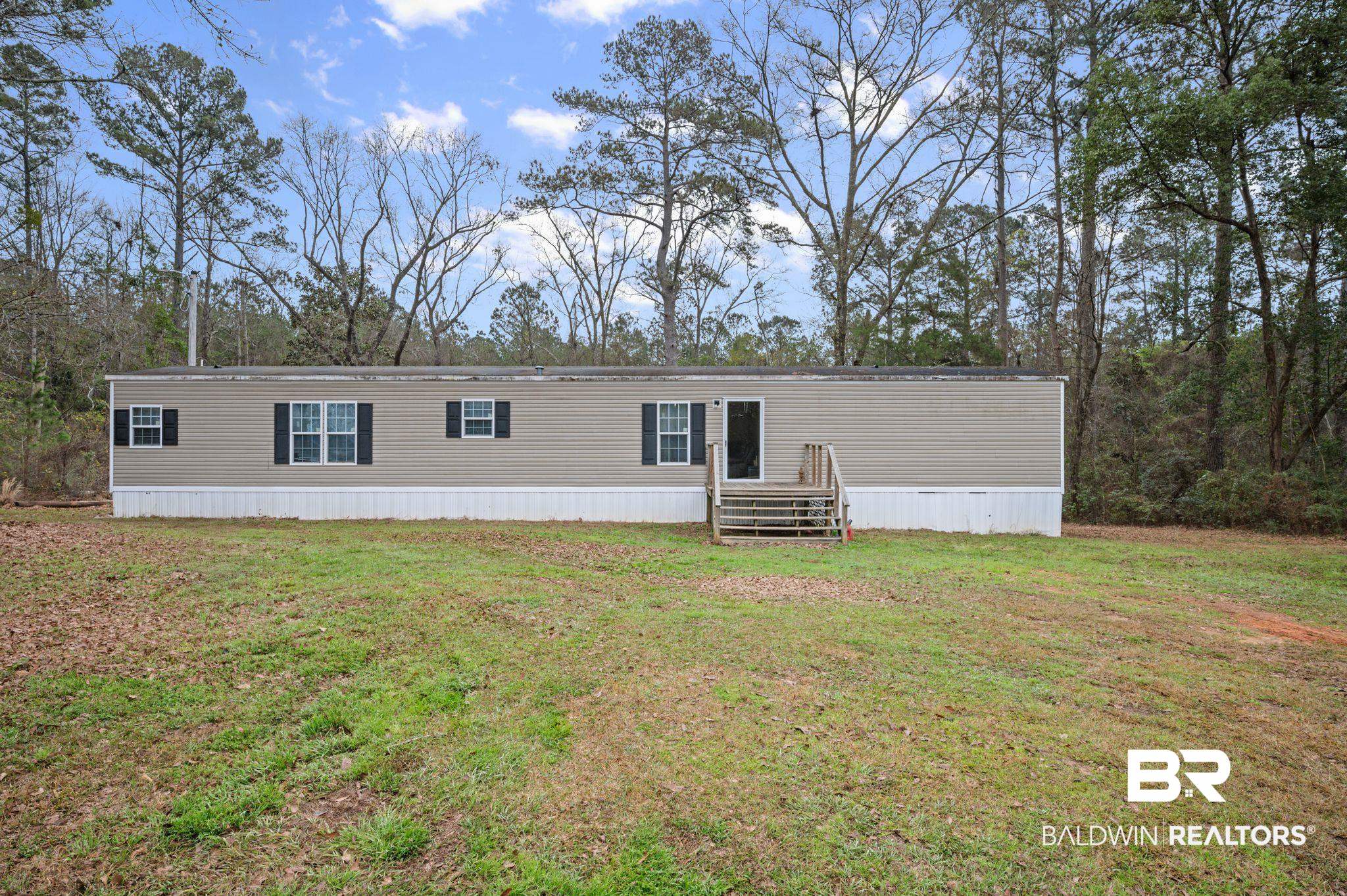 39908 T A Chastang Road Bay Minette, AL 36507 - Photo 2 of 20 View of front facade with a front lawn