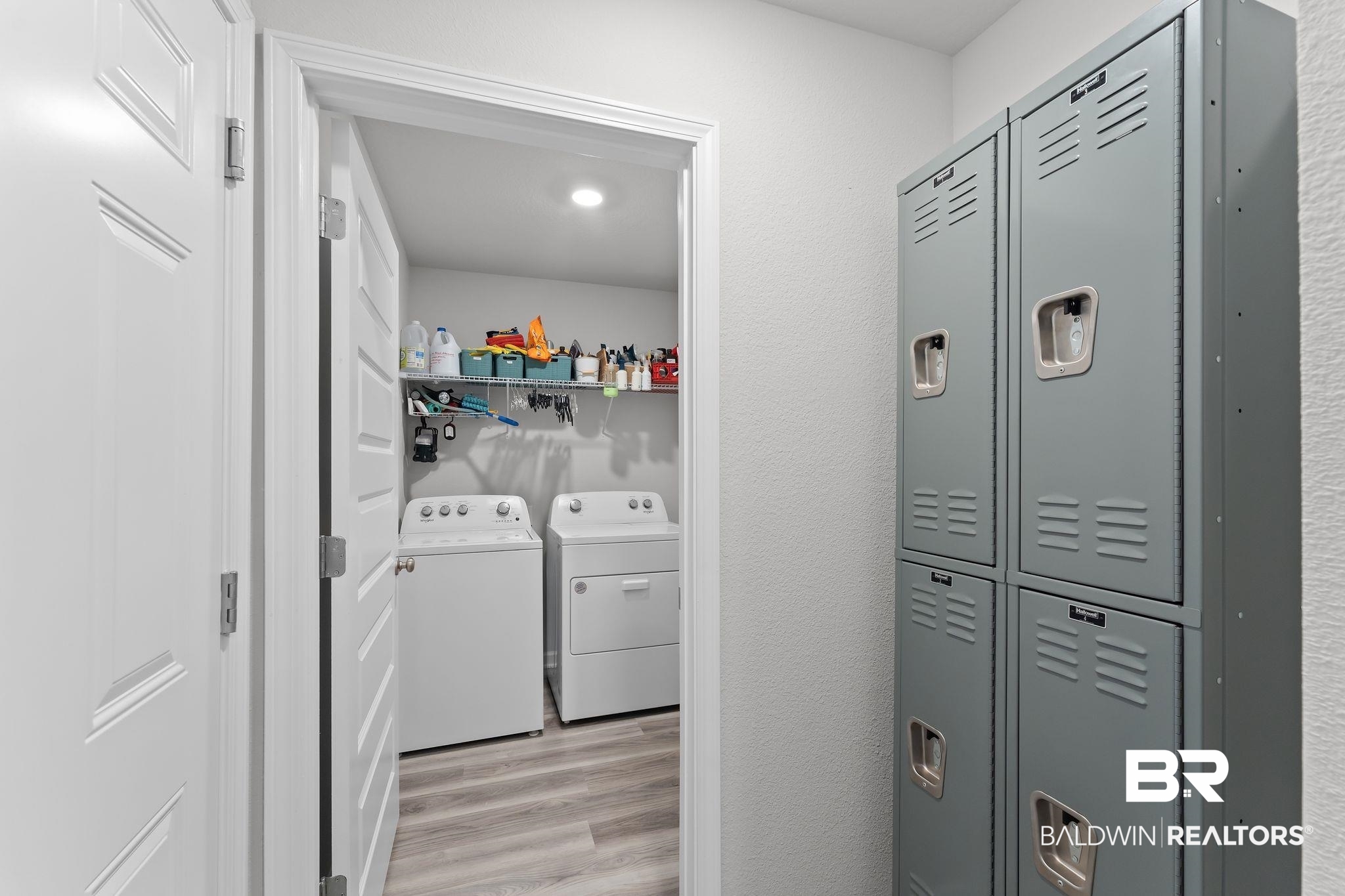 24337 Ringneck Loop Elberta, AL 36530 - Photo 27 of 34 Laundry area featuring light wood finished floors and washing machine and dryer