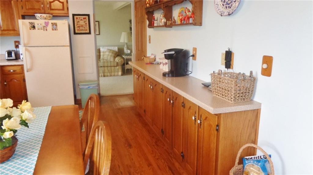 5075 West Harbison Road Pittsburgh, PA 15276 - Photo 4 of 21 BEAUTIFUL UPDATED KITCHEN, WITH HARD WOOD FLOOR, EXTRA STORAGE IN SIDE BUFFET