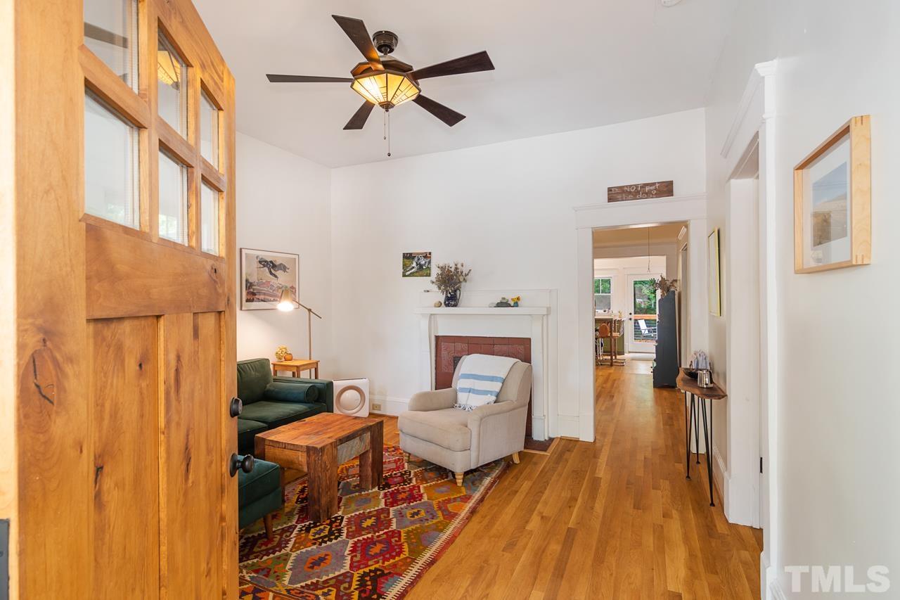 1808 Rosetta Drive Durham, NC 27701 - Photo 11 of 59 a living room with furniture a ceiling fan and a wooden floor