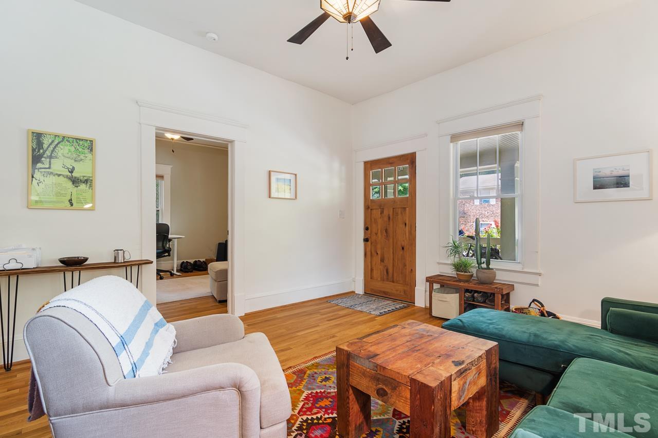 1808 Rosetta Drive Durham, NC 27701 - Photo 14 of 59 a living room with furniture and wooden floor
