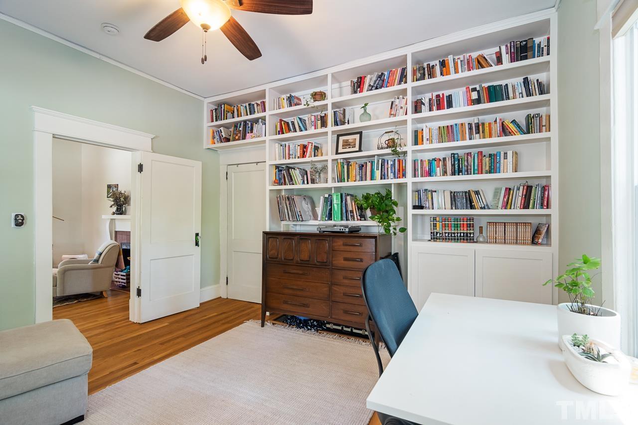 1808 Rosetta Drive Durham, NC 27701 - Photo 15 of 59 a living room with furniture and a book shelf