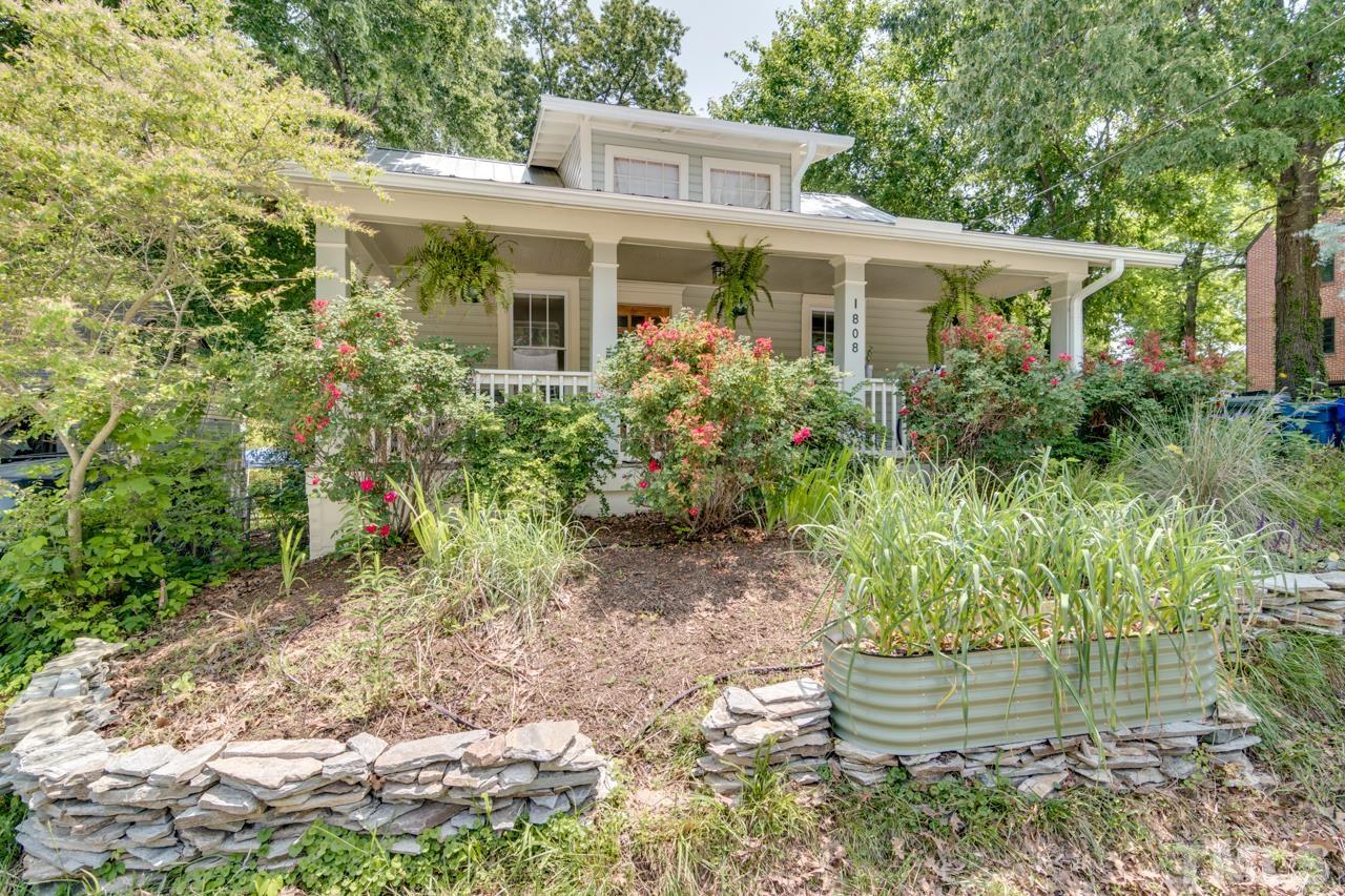 1808 Rosetta Drive Durham, NC 27701 - Photo 2 of 59 a front view of a house with a yard