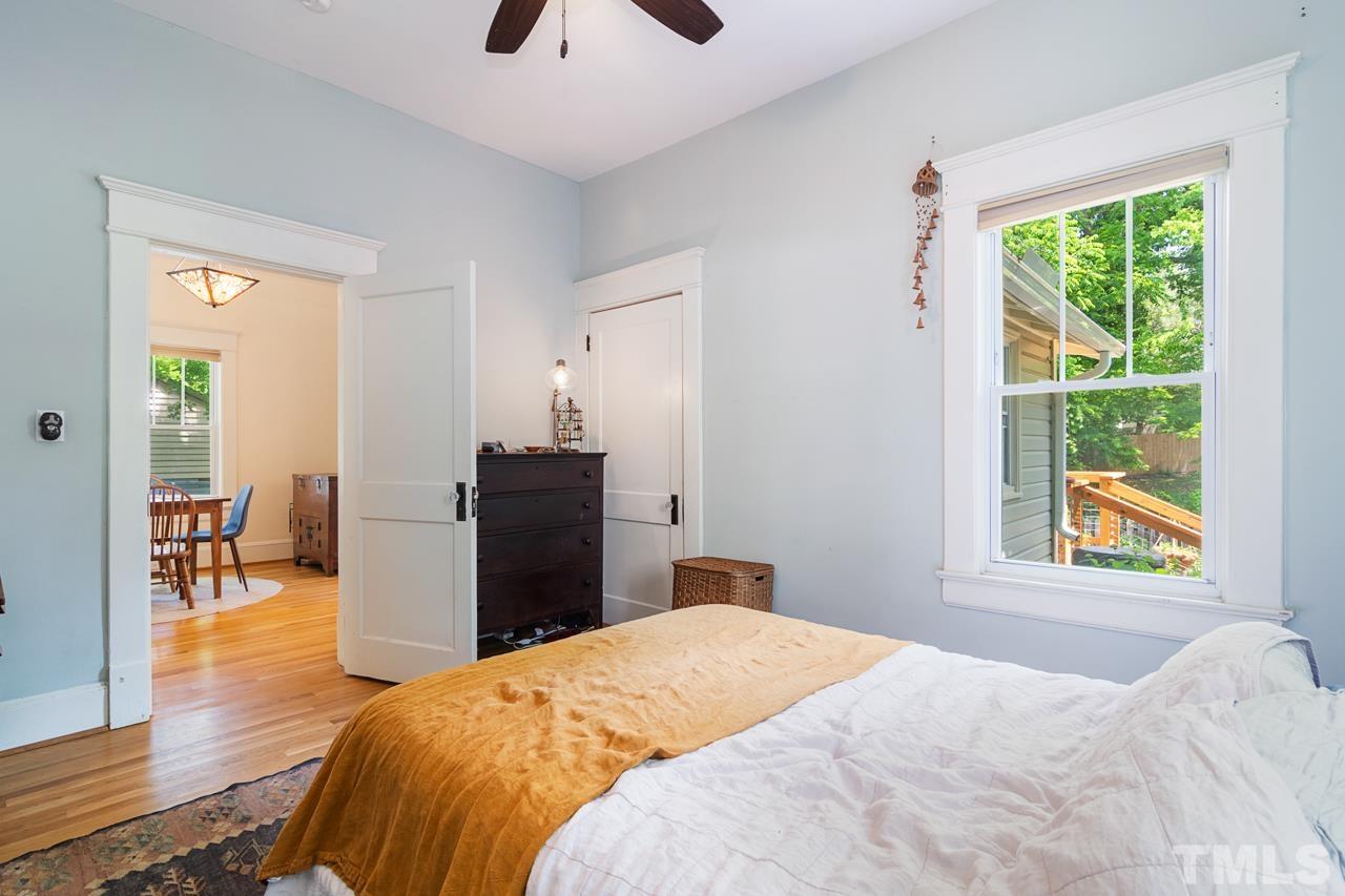 1808 Rosetta Drive Durham, NC 27701 - Photo 37 of 59 a bedroom with a bed and wooden floor