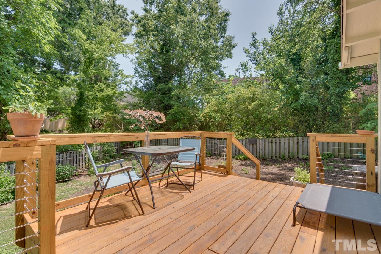 1808 Rosetta Drive Durham, NC 27701 - Photo 40 of 59 a view of balcony with wooden floor and outdoor seating