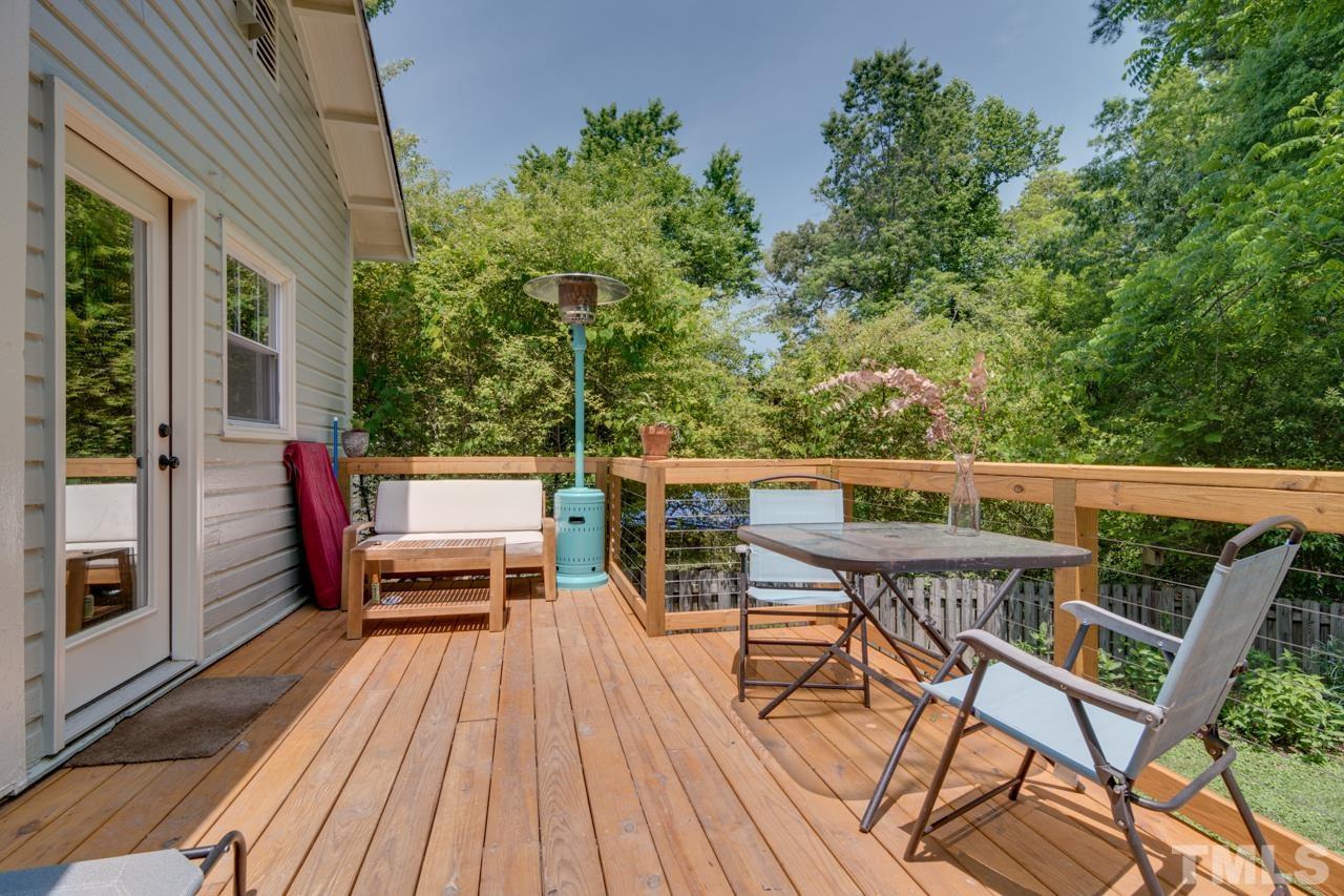 1808 Rosetta Drive Durham, NC 27701 - Photo 41 of 59 a balcony with wooden floor and outdoor seating