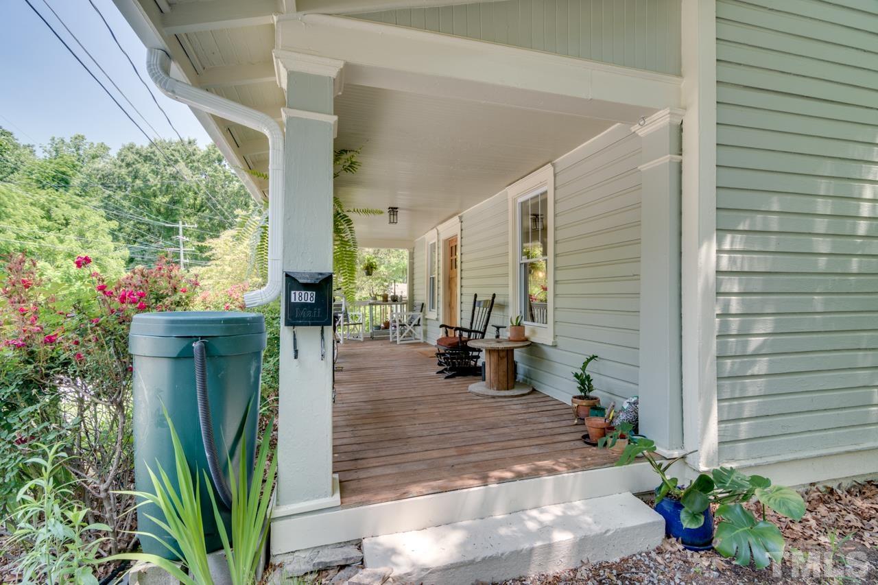 1808 Rosetta Drive Durham, NC 27701 - Photo 5 of 59 a view of a porch with chairs and potted plants