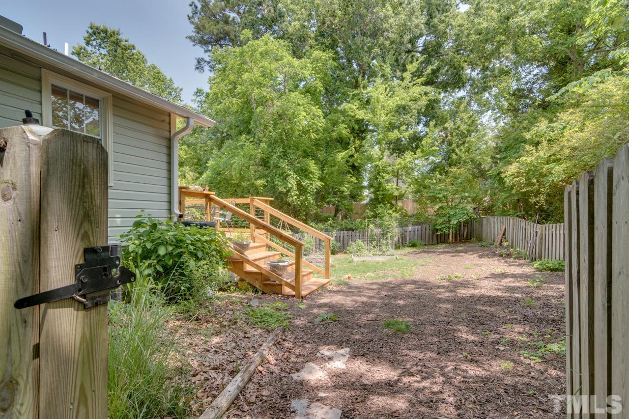 1808 Rosetta Drive Durham, NC 27701 - Photo 51 of 59 a backyard of a house with lots of green space