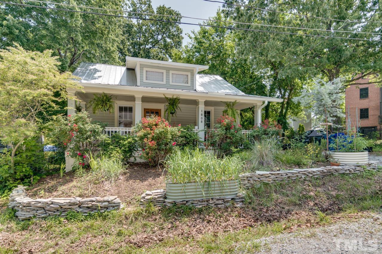 1808 Rosetta Drive Durham, NC 27701 - Photo 52 of 59 a front view of a house with a yard