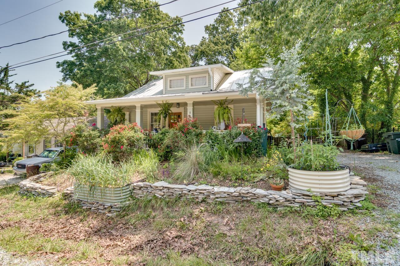 1808 Rosetta Drive Durham, NC 27701 - Photo 53 of 59 a front view of a house with a yard