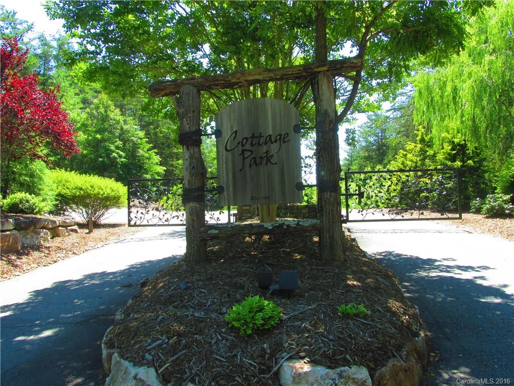 9999 Cottage Park Drive, Unit 3 Morganton, NC 28655 - Photo 2 of 17 a view of a yard with plants and large trees