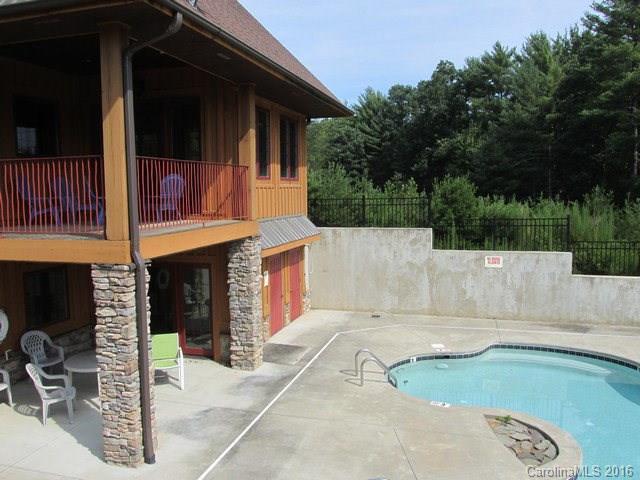 9999 Cottage Park Drive, Unit 3 Morganton, NC 28655 - Photo 17 of 17 a view of a backyard with a barbeque and large trees