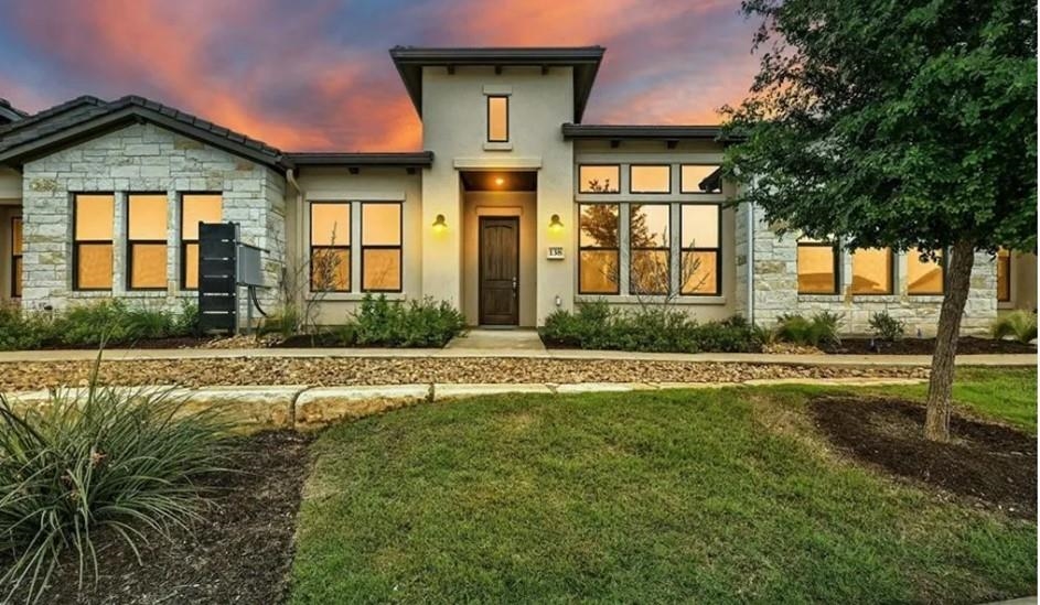 138 Rivalto Drive Horseshoe Bay, TX 78657 - Photo 1 of 1 a front view of a house with a yard and porch